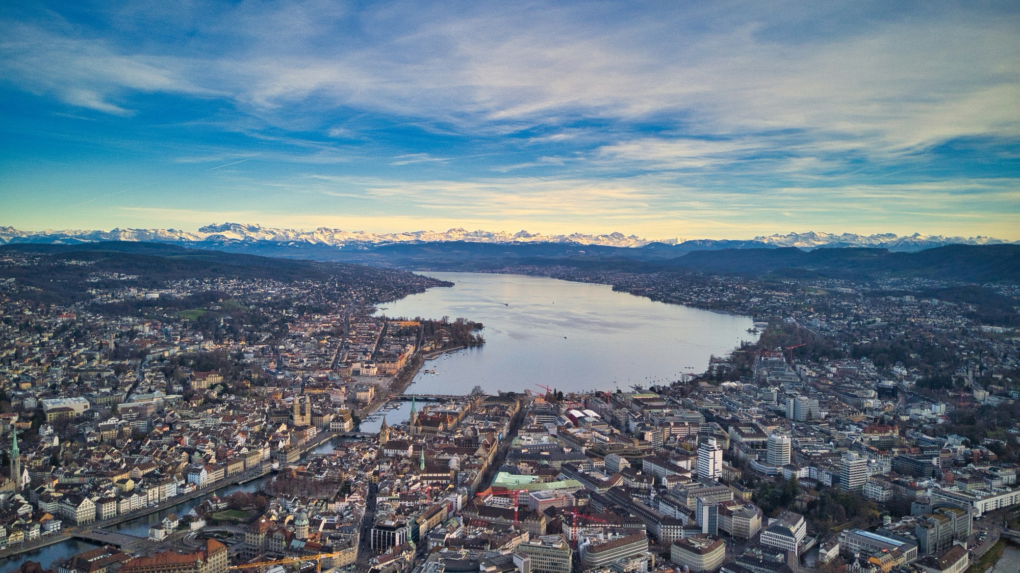 Aerial view of Zürich, Switzerland, with the lake and the Alps on the horizon